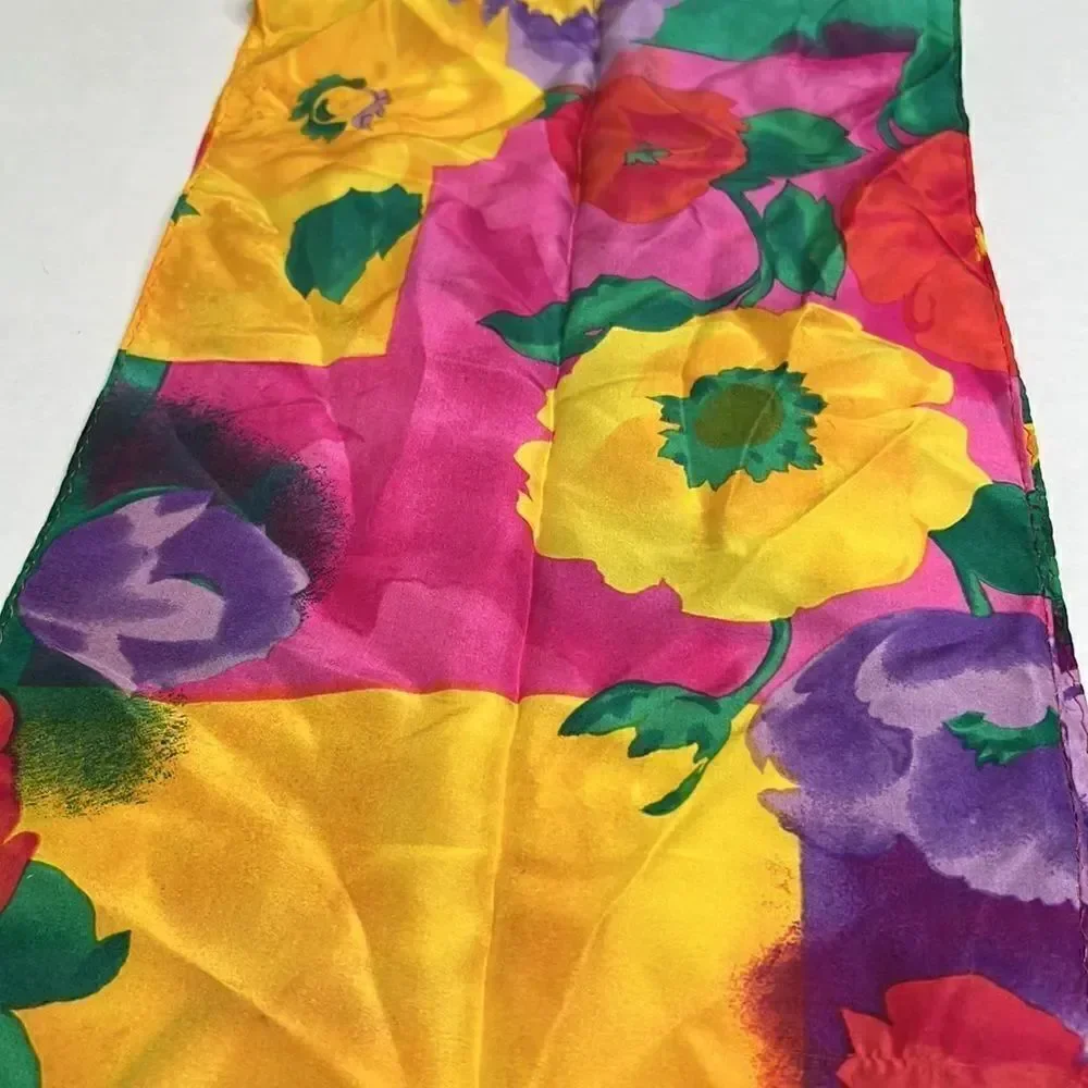 Vibrant floral silk scarf with gold purple pink and red flowers.